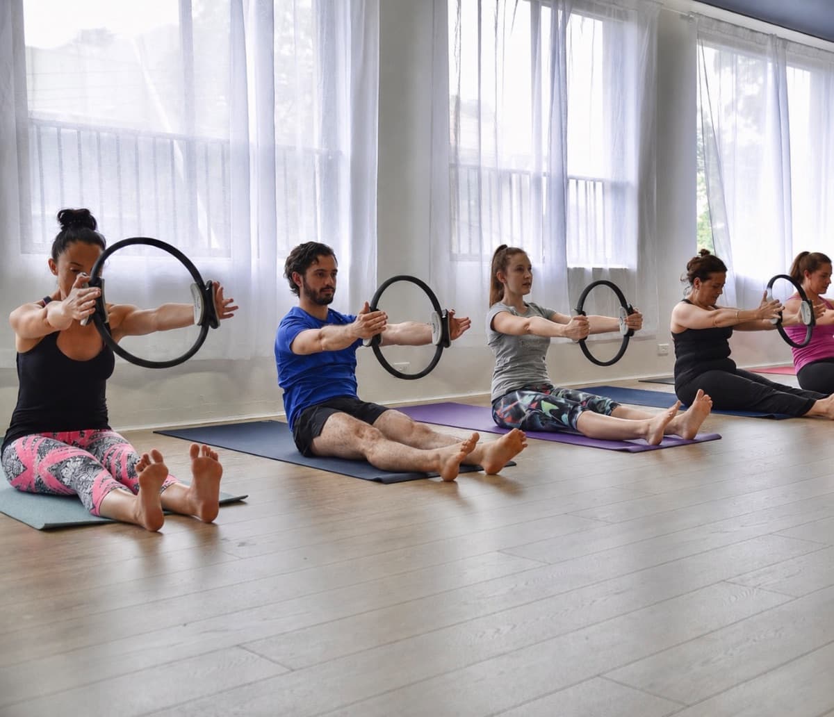 Mat pilates class using Pilates rings at Evolvere Lane Cove