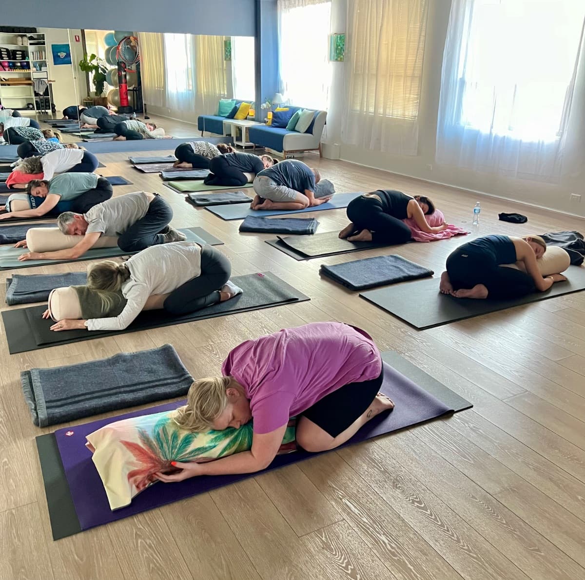 Child's pose with blankets during a calming restorative yoga practice