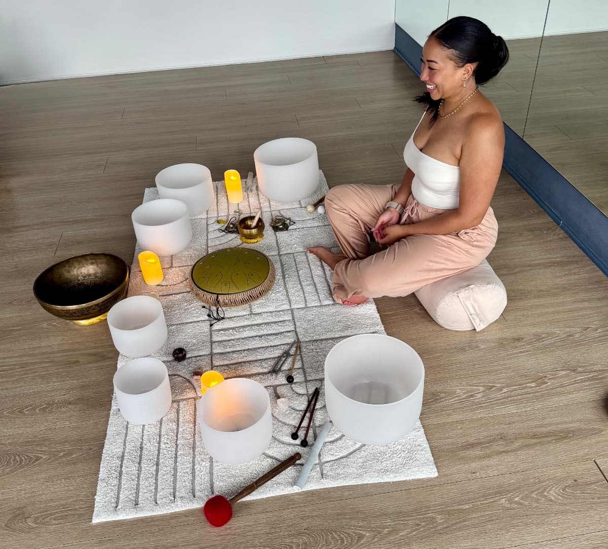 Sound healing practitioner with crystal singing bowls and tibetan bowls at Evolvere Lane Cove