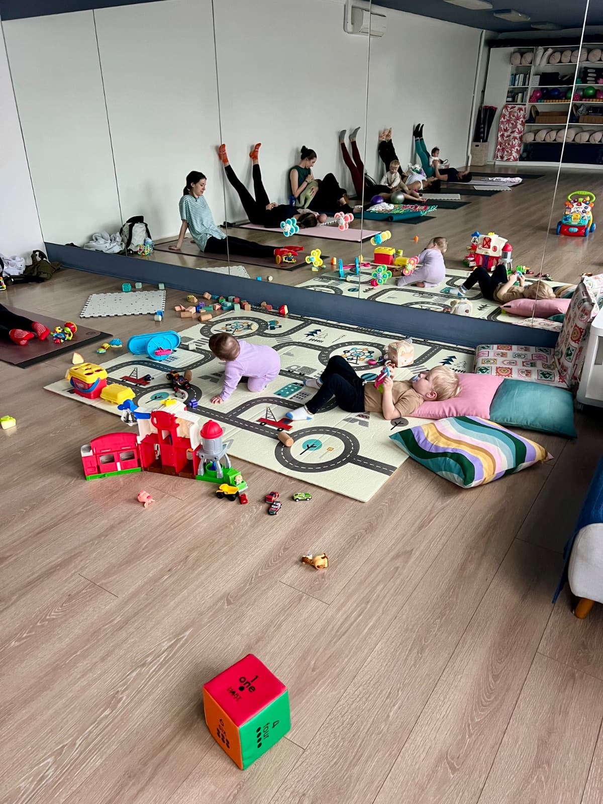 Mum bonding with baby during yoga class at Evolvere