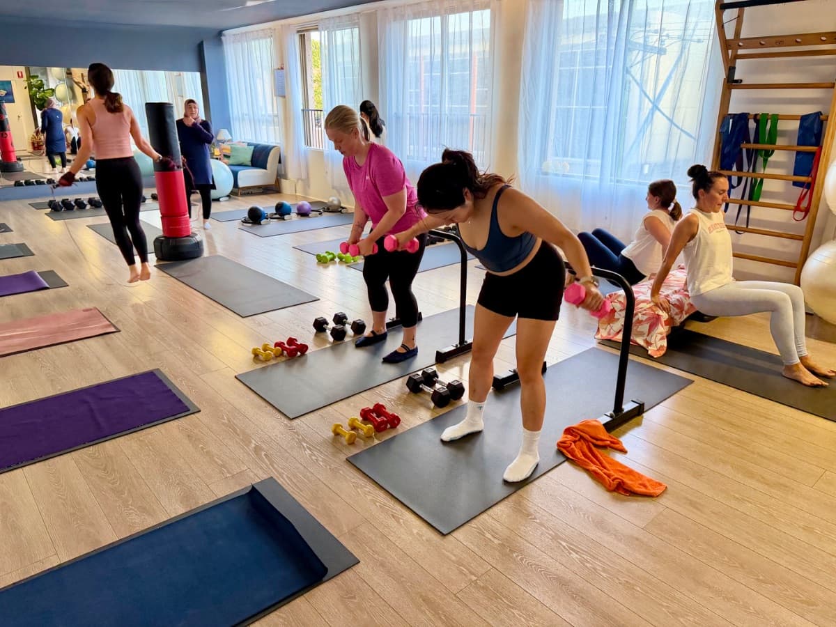 Strength circuit station with dumbbells and resistance equipment at Evolvere